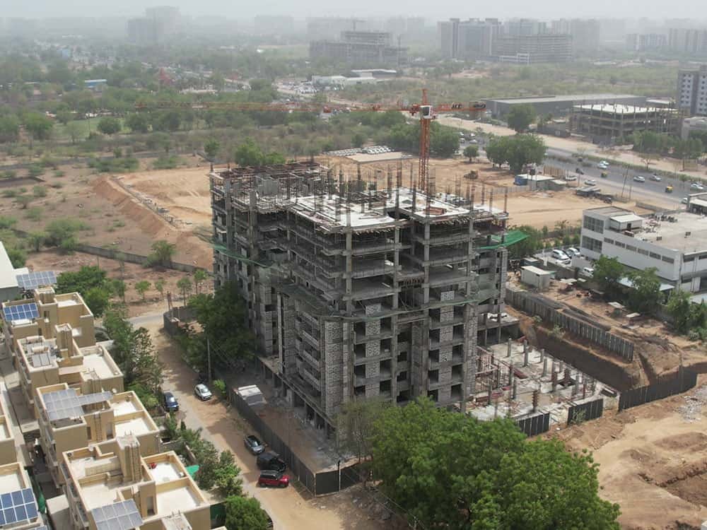 - Arise Ananta – Green Mixed-Use High-Rise in Ahmedabad - Sustainable 2 BHK Apartments & Shops Arise Ananta - IGBC Platinum Pre-certified Arise Ananta Ahmedabad - Radhe Buildcon’s Eco-Friendly High-Rise Arise Ananta - Arise Ananta – Sustainable Mixed-Use High-Rise in Ahmedabad - Eco-Friendly 2 BHK Apartments & Retail at Arise Ananta - IGBC Platinum Green Homes: Arise Ananta by Radhe Buildcon - Arise Ananta exterior with green terraces and modern façade - 2 BHK apartment interior featuring passive design at Arise Ananta - Ground-floor retail shops at Arise Ananta high-rise - Fenestration patterns and broken symmetry on Arise Ananta façade - IGBC Platinum Green Homes certification plaque at Arise Anant