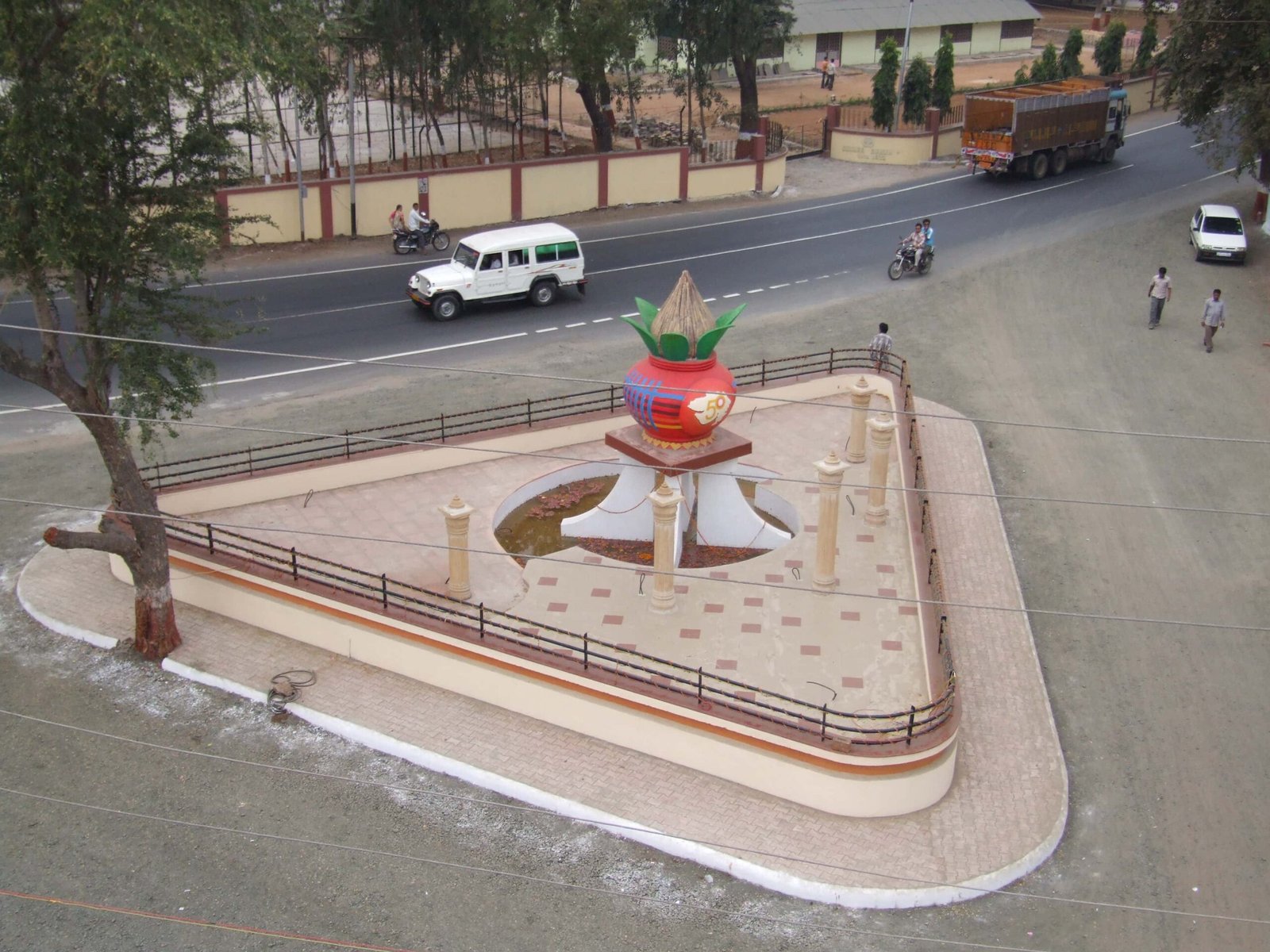 - Swarnim Gujarat Circle, Godhra: vibrant aerial view of dynamic metal ribbons and LED accents celebrating statehood milestones
