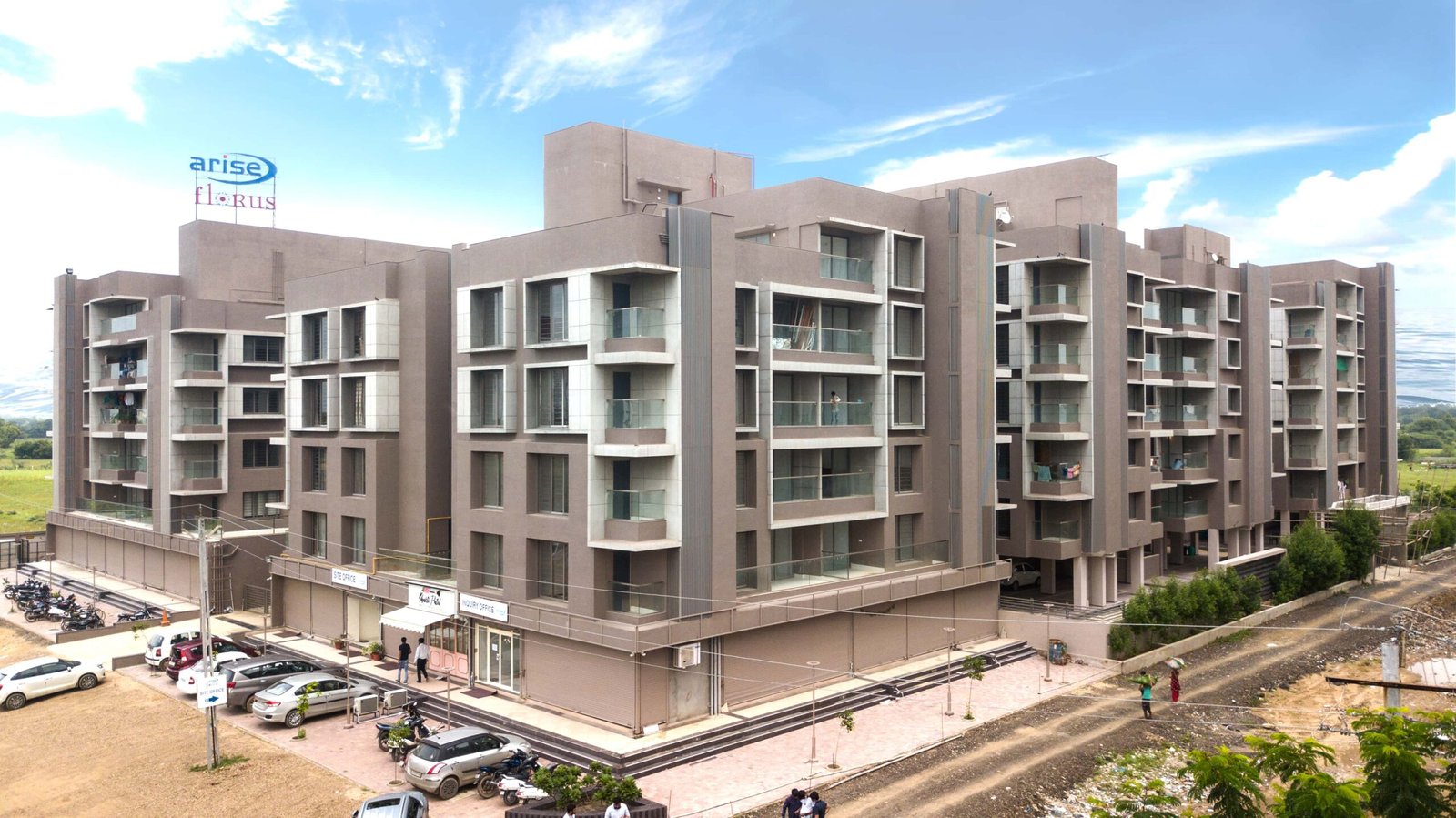 - Arise Florus – Sustainable Luxury Living in Ahmedabad - Arise Florus Eco-Friendly Residential & Commercial Hub - Arise Florus Ahmedabad – Green Design & Modern Comfort - Modern Architecture & Green Living Arise Florus - Arise Florus – Eco-Conscious Architecture in Ahmedabad - Sustainable Residences & Commercial Spaces Arise Florus - Modern Luxury Meets Green Living at Arise Florus - Front view of Arise Florus with landscaped green lawns - Child playing in playground at Arise Florus community garden - Senior citizens enjoying seating area amidst Arise Florus greenery - Panoramic street-facing fenestration at Arise Florus apartments - Solar panels and rainwater harvesting setup at Arise Florus