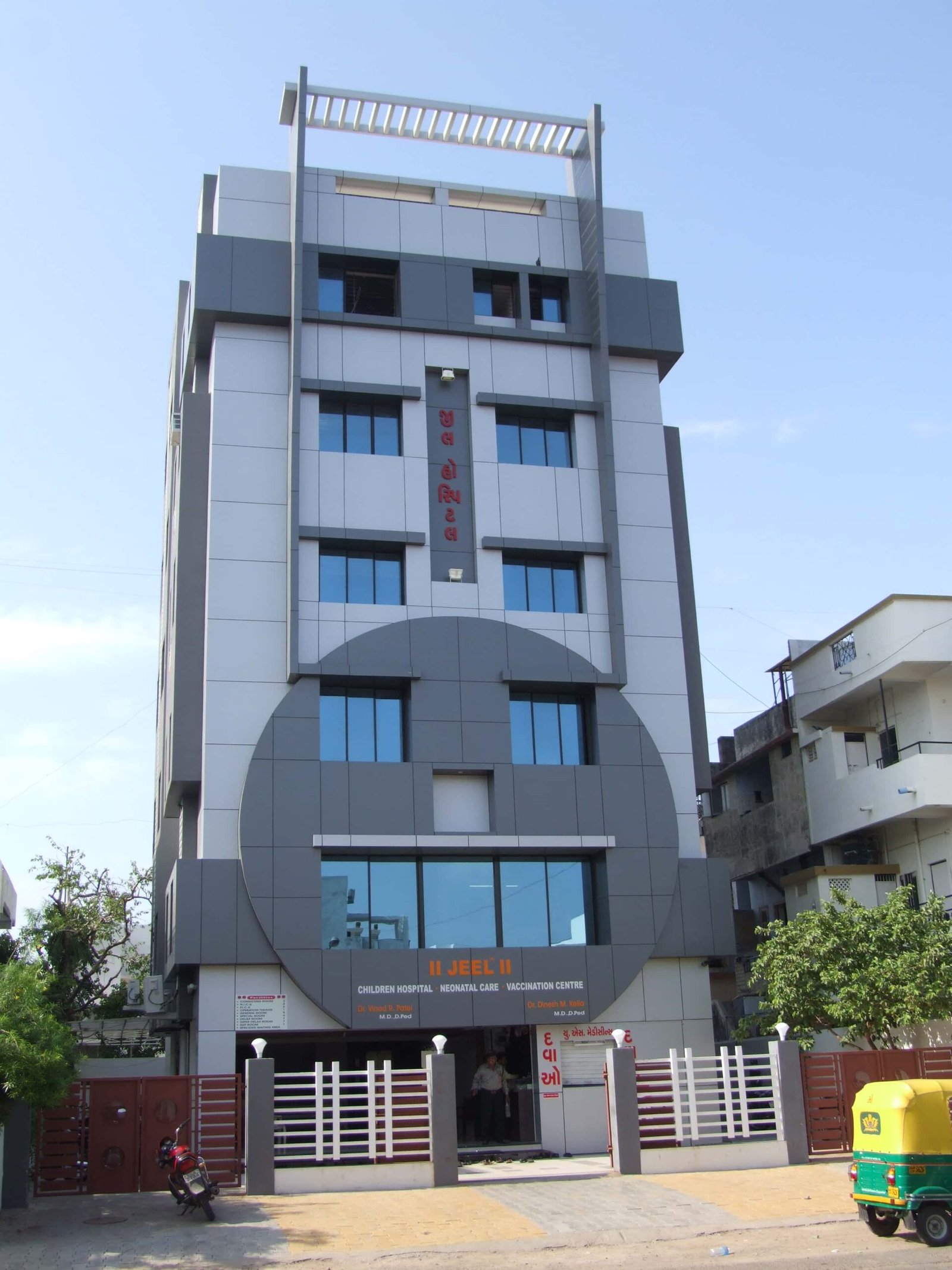 - Front elevation of Jeel Children Hospital in Ahmedabad showing a colourful, child-friendly façade with playful architectural motifs - Interior view of a pediatric ward at Jeel Children Hospital with vibrant wall art, kid-sized furniture, and natural daylight - Interactive play area in the hospital’s family lounge featuring whimsical sculptures, seating nooks, and soft flooring - State-of-the-art operating theatre at Jeel Children Hospital with advanced medical equipment and efficient room layout - Quiet family support room at Jeel Children Hospital with cosy seating, warm lighting, and privacy partitions