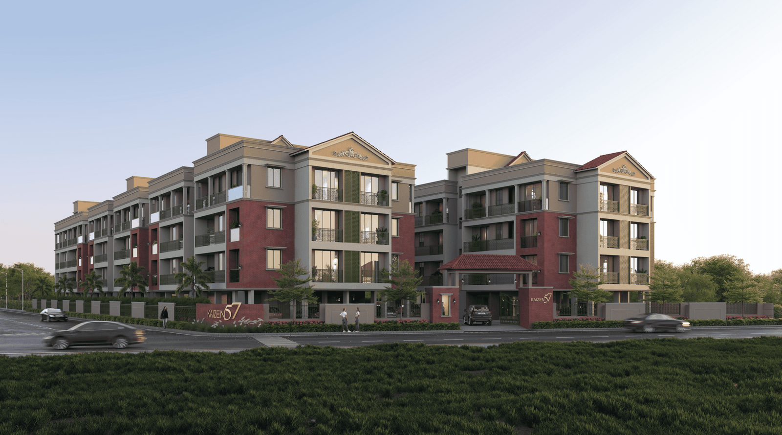 - Front elevation of Kaizen 57 showcasing exposed brick façade, sloped terracotta roofs, and ornate balcony railings - Aerial view of Kaizen 57 residential blocks surrounded by landscaped greens and community spaces - Grand entrance gateway of Kaizen 57 with brick pillars and integrated signage - Children’s play area and shaded seating zone within Kaizen 57’s landscaped courtyard - Balcony detail at Kaizen 57 featuring decorative metal railings and arched windows