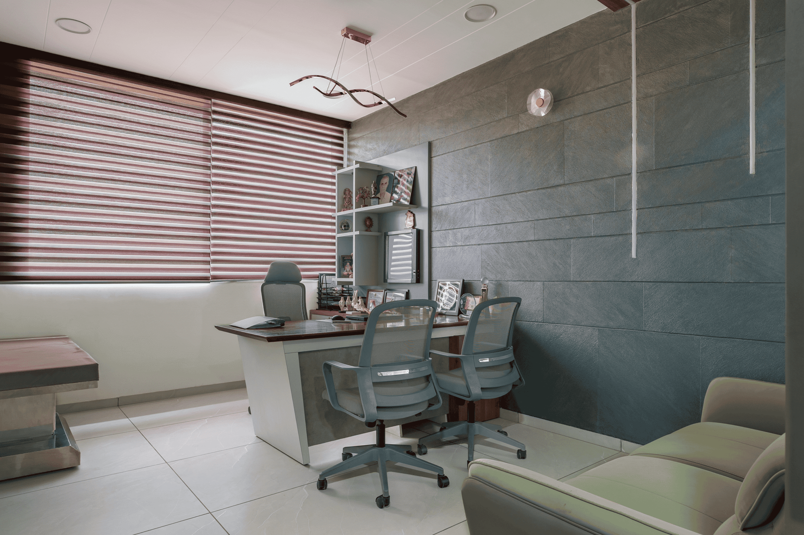 Reception and waiting area of Olwen Hospital in Ahmedabad designed by Vastu Nirman Architects featuring warm wood finishes and calming interior design