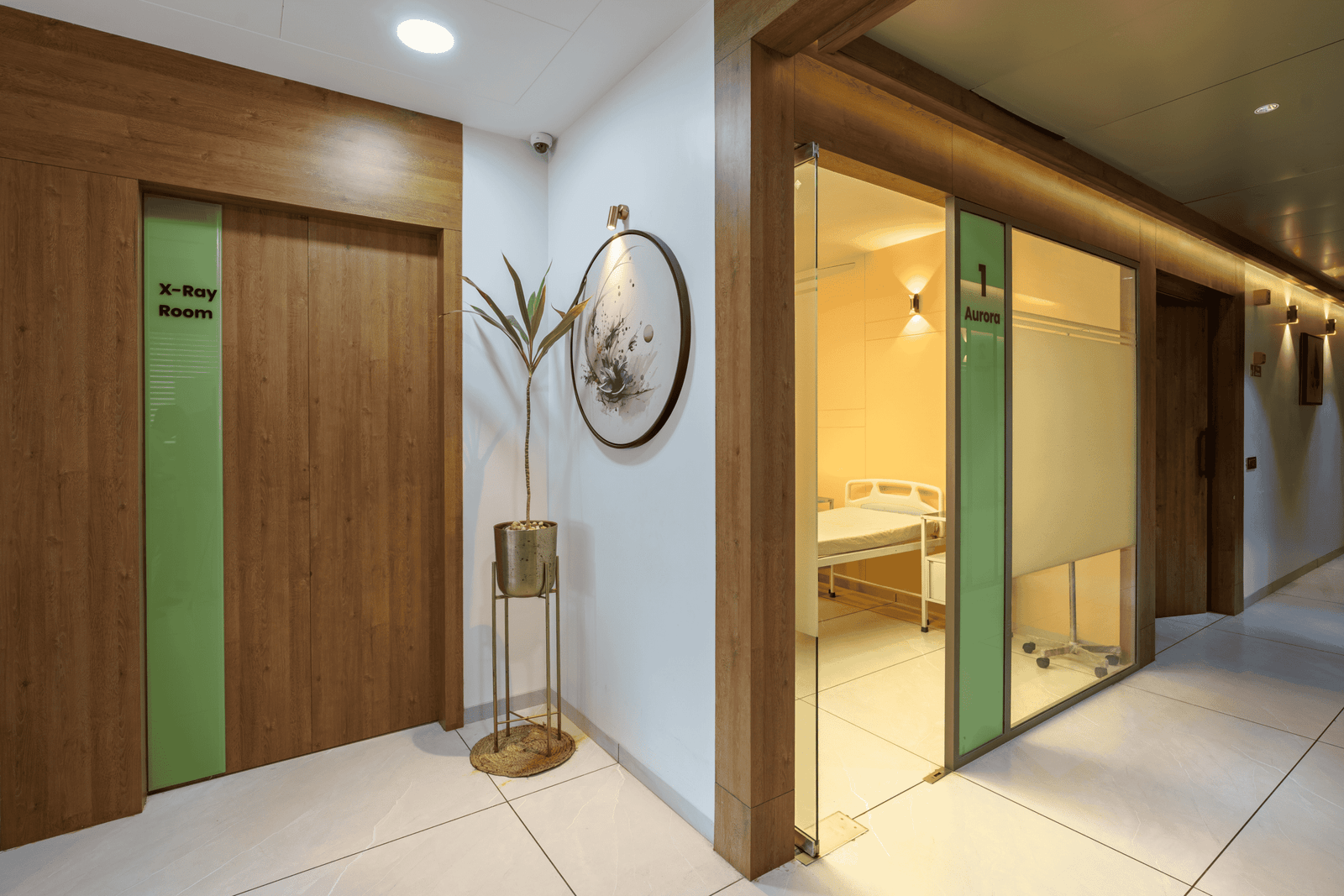 Reception and waiting area of Olwen Hospital in Ahmedabad designed by Vastu Nirman Architects featuring warm wood finishes and calming interior design