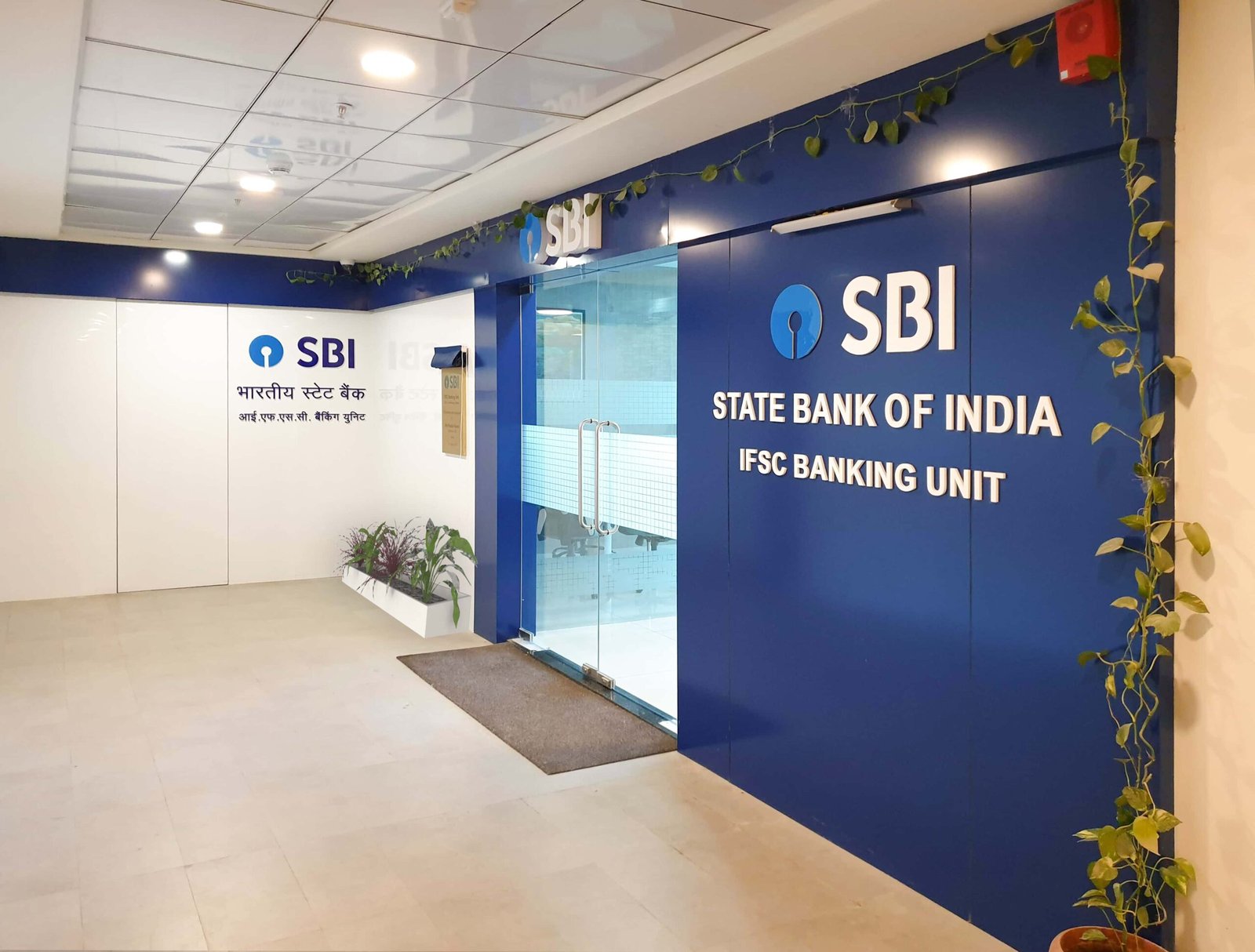 - Interior view of SBI IFSC Unit office featuring modern workstations and collaborative spaces - Ergonomic office furniture and branded design elements at SBI IFSC Unit, GIFT City - Corporate meeting room with contemporary design at SBI IFSC Unit, Gandhinagar - Reception area of SBI IFSC Unit showcasing brand-integrated interior design - Workspace layout at SBI IFSC Unit optimized for efficiency and employee comfort