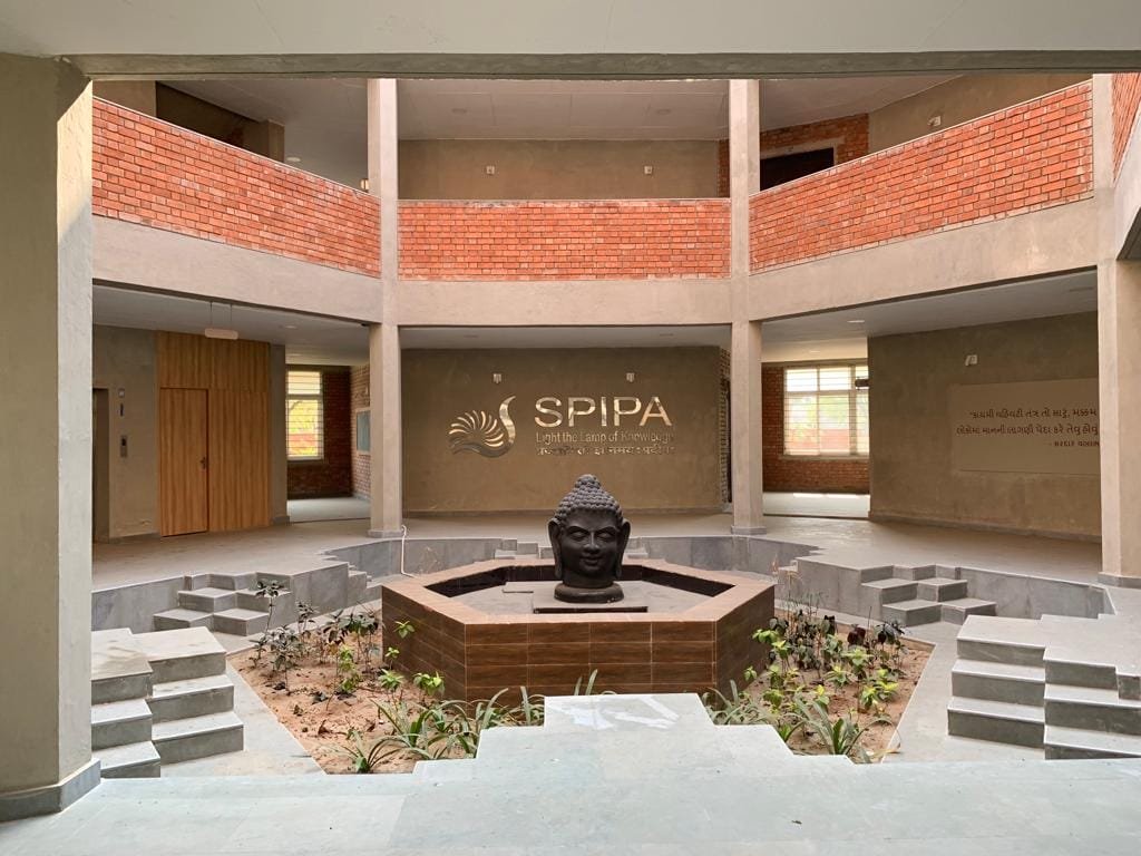 - SPIPA Regional Training Centre, Mehsana – Architecture & Design - SPIPA Mehsana Hub Architecture, Interior & Landscape - Regional Training Centre SPIPA Mehsana – Innovative Spaces - SPIPA Mehsana Campus: Learning Through Design - SPIPA Regional Training Centre, Mehsana – Design Excellence - Inspiring Learning & Living at SPIPA Mehsana - Integrated Architecture, Interior & Landscape for SPIPA - Front view of SPIPA Regional Training Centre Mehsana - Contemporary façade of SPIPA’s training centre - Inviting hostel interior with custom furnishings at SPIPA - Landscaped courtyard and green spaces at SPIPA Mehsana - Sustainable water feature in SPIPA’s campus landscape