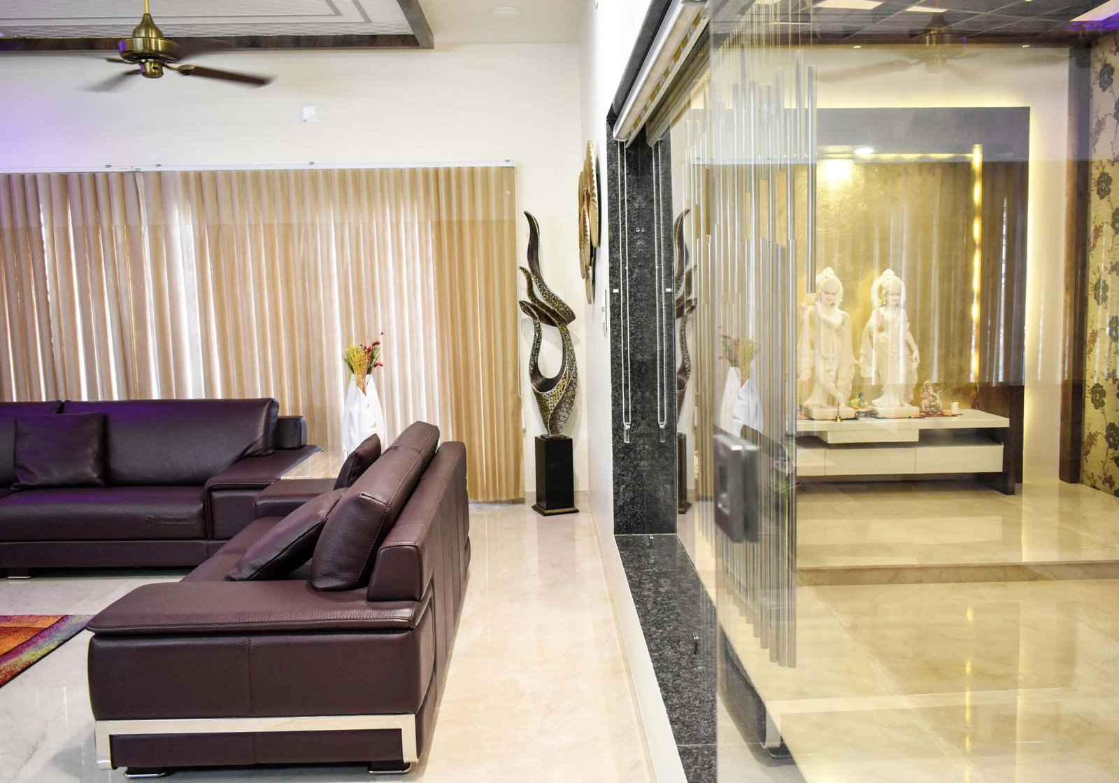 - Front view of Savaliya House showcasing its sleek contemporary facade with large floor-to-ceiling windows - Open-plan living area with minimalist furnishings and abundant natural light streaming through oversized glazing - Modern bungalow exterior at Savaliya House highlighting clean lines, a neutral material palette, and landscaped surroundings - Luxurious interior vignette featuring premium finishes, bespoke furniture, and subtle textural contrasts - Indoor-outdoor transition at Savaliya House with sliding glass doors opening onto a private courtyard garden
